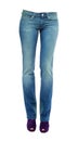 Young woman legs with clear blue jeans and purple peep toe pumps Royalty Free Stock Photo