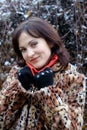 Young woman in leopard fur coat and red scarf Royalty Free Stock Photo