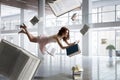 Young woman levitates while reading a book Royalty Free Stock Photo