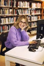 Young woman librarian working in a city library Royalty Free Stock Photo