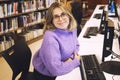 Young woman librarian working in a city library Royalty Free Stock Photo