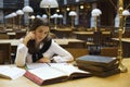 Young woman in library Royalty Free Stock Photo
