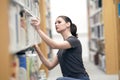 Young woman in the library Royalty Free Stock Photo