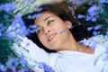 Young woman lies in the lavender flower field, beautiful summer landscape Royalty Free Stock Photo