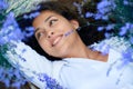 Young woman lies in the lavender flower field, beautiful summer landscape Royalty Free Stock Photo