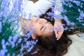 Young woman lies in the lavender flower field, beautiful summer landscape Royalty Free Stock Photo