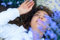 Young woman lies in the lavender flower field, beautiful summer landscape Royalty Free Stock Photo