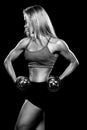 Woman lifting dumbbells black and white photo