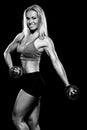 Woman lifting dumbbells black and white photo