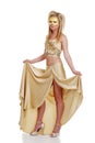 Young woman lifting her gold dress Royalty Free Stock Photo
