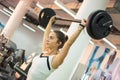 Young woman lifting weights at gym. Royalty Free Stock Photo