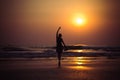 Young woman like a ballet dancer at sunset in Arambol beach, Nor Royalty Free Stock Photo