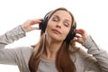 Young woman listening music with headphones
