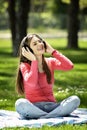 Young woman listening music in nature is my hobby Royalty Free Stock Photo