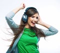 Young woman listening music. Teenager girl dancing