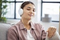 Young woman is listening to music