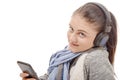 Young woman listening to music with his mobile phone and headph Royalty Free Stock Photo