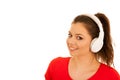 Young woman listens music with headset isolated over white backg Royalty Free Stock Photo
