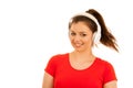 Young woman listens music with headset over white backg Royalty Free Stock Photo