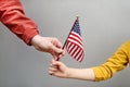 Young woman and little child holding american flag. Independence Day concept Royalty Free Stock Photo