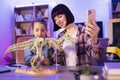 Young woman and little cute girl filming video of their scientific research. Royalty Free Stock Photo