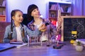 Young woman and little cute girl filming video of their scientific research. Royalty Free Stock Photo