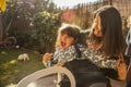 Young woman and little girl putting funny faces in a sunny day. Royalty Free Stock Photo