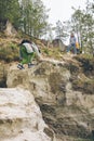 Young woman with little toddler boy climbing by rocks Royalty Free Stock Photo