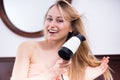 woman hairdryer in room Royalty Free Stock Photo