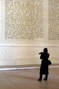 Young woman in long coat taking pictures inside Lincoln Memorial,Washington,DC,2015 Royalty Free Stock Photo