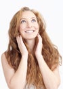 Young Woman with Long Hair Looking up Smiling