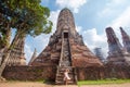 Woman sitting in front of the Wat Chaiwatthanaram in Ayutthaya