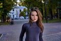 A young woman with long hair in a turtleneck, shorts and boots on a walk a park Royalty Free Stock Photo