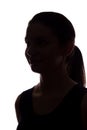 Young woman look ahead with flowing hair - vertical silhouette Royalty Free Stock Photo