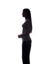 Young woman look ahead with flowing hair - vertical silhouette Royalty Free Stock Photo