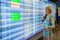 Young woman look at flight timetable worries Royalty Free Stock Photo