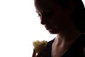 Young woman look on flower - horizontal silhouette of a side view Royalty Free Stock Photo