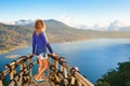 Young woman looking at amazing tropical lake in mountains Royalty Free Stock Photo