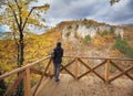 Young woman looking on autumn canyon