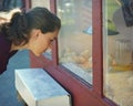 Young Woman looking at Baby Chicks Royalty Free Stock Photo