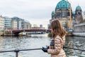 Young woman looking at Berlin Cathedral