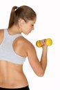 Young Woman Looking at Bicep Curl Royalty Free Stock Photo