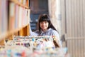 Young Woman Looking At Books In A Bookstore Royalty Free Stock Photo