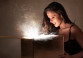 Young woman looking into a box Royalty Free Stock Photo