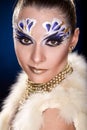 Young woman looking at the camera with fantasy make up face art studio shot. Royalty Free Stock Photo