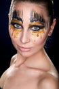 Young woman looking at the camera with fantasy make up face art studio shot. Royalty Free Stock Photo