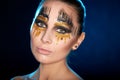 Young woman looking at the camera with fantasy make up face art studio shot. Royalty Free Stock Photo