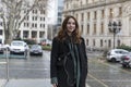 Young Woman Looking at Camera Posing in City