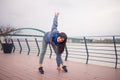 Young woman stretching before run. Cloudy day near river Royalty Free Stock Photo