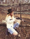 Young woman looking down the barrel of a gun Royalty Free Stock Photo